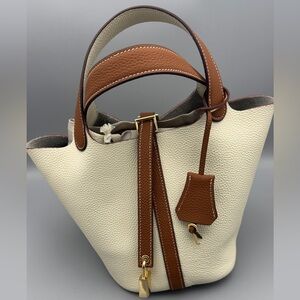 NWOT Duo, colored cream and brown leather bucket bag with lock & key accent